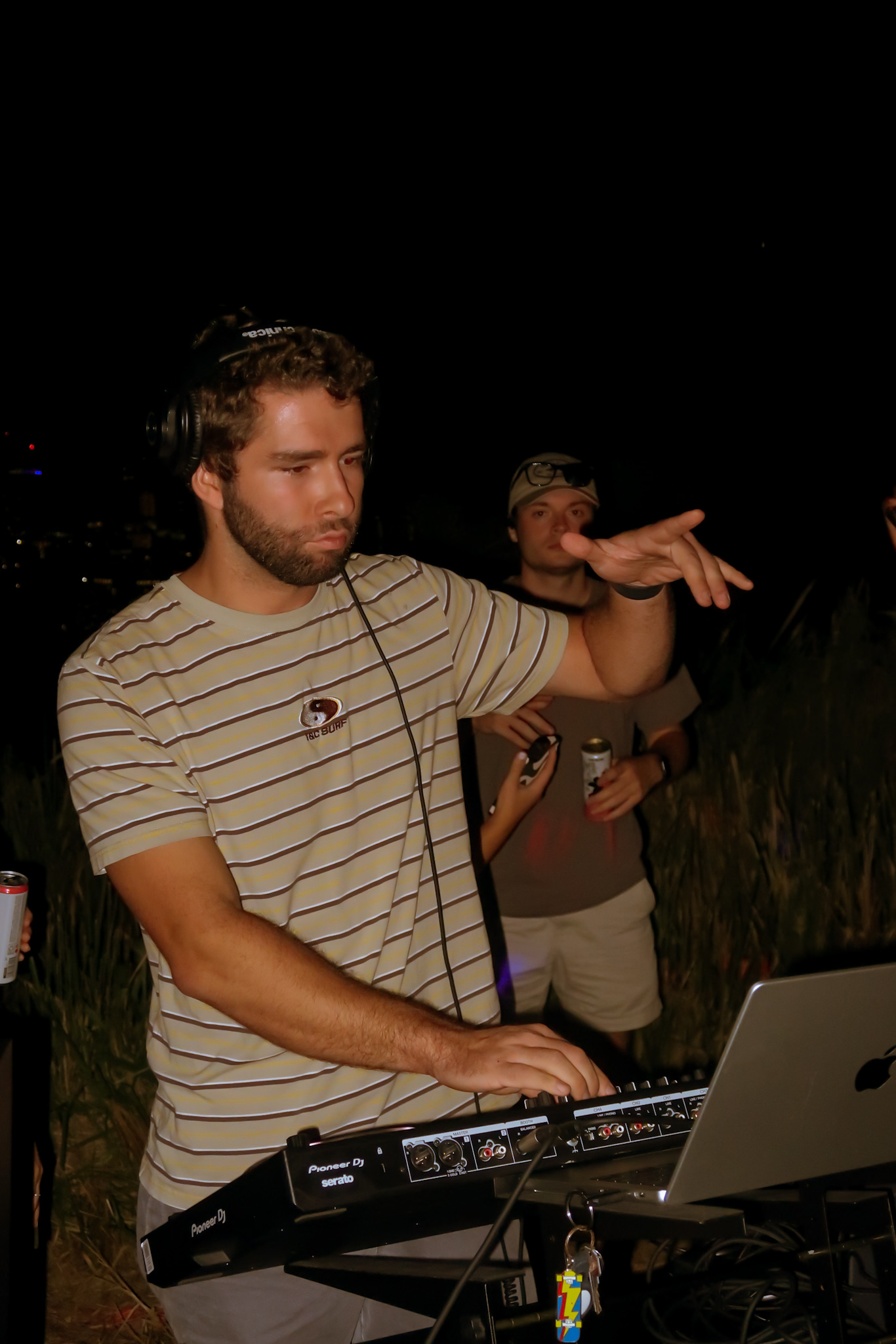 DJ at Pioneer setup at night