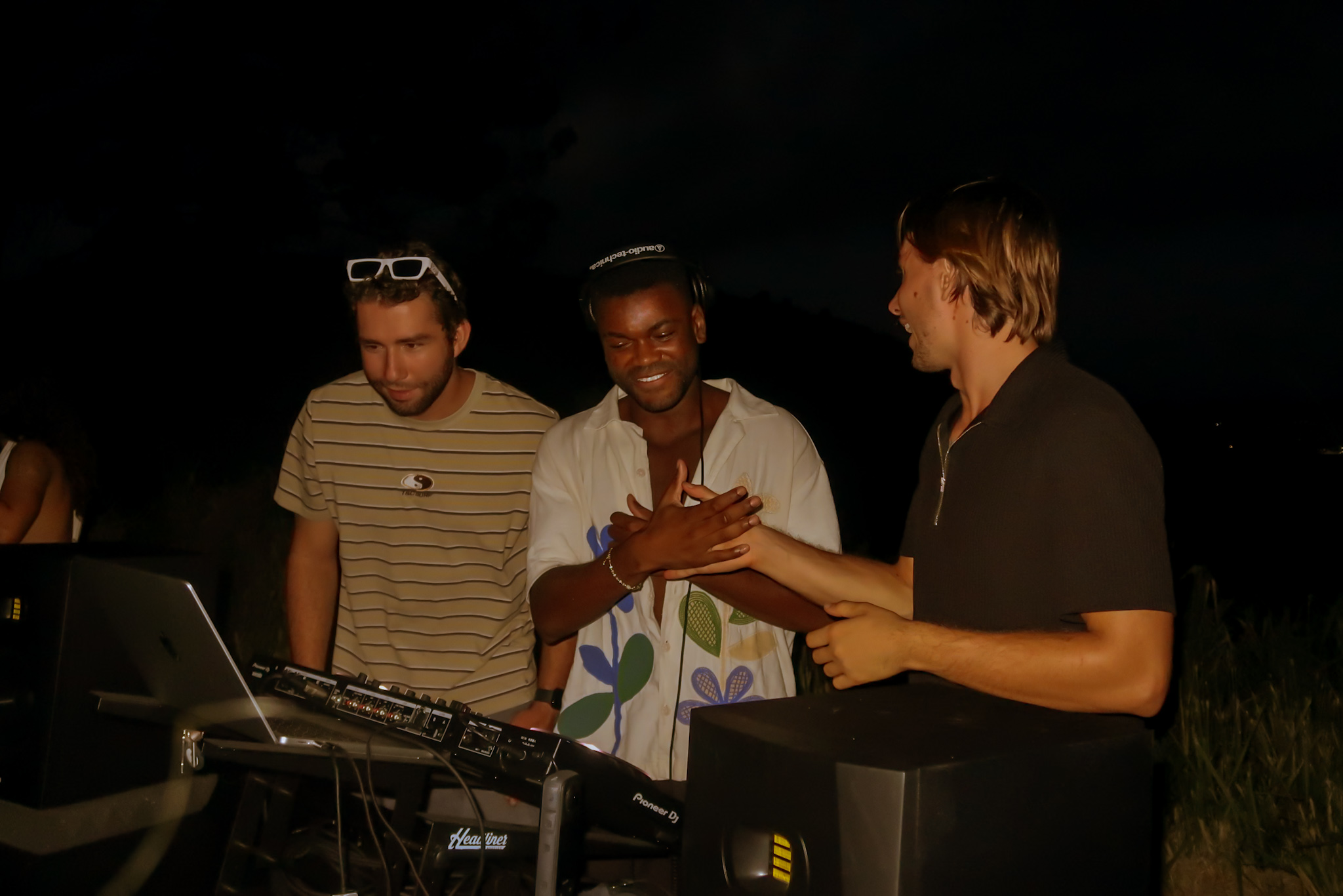Three at the DJ booth