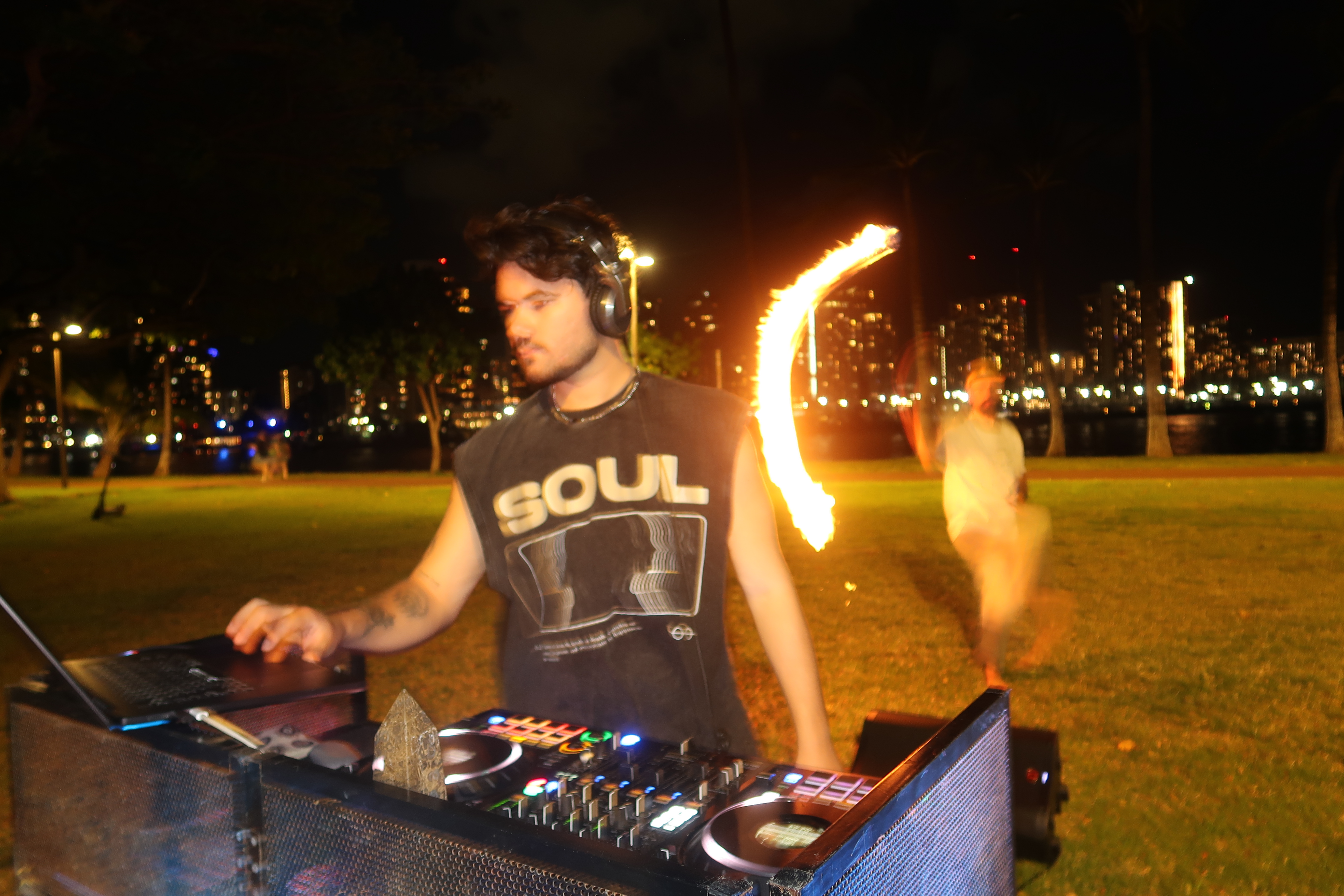 DJ with fire dancer at Magic Island